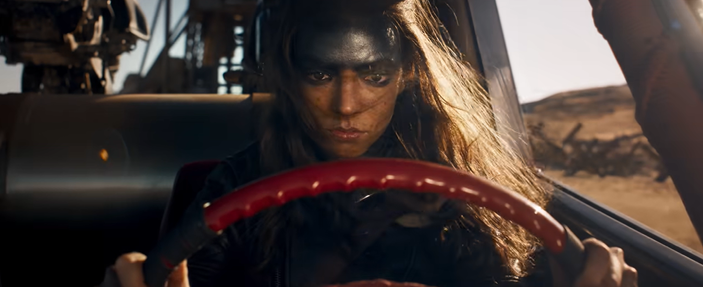 The trailer of Furiosa shows Anya Taylor Joy behind the wheel of a car