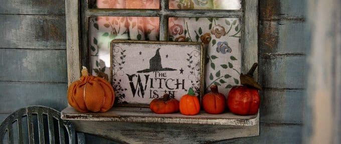 pumpkins and a witch sign