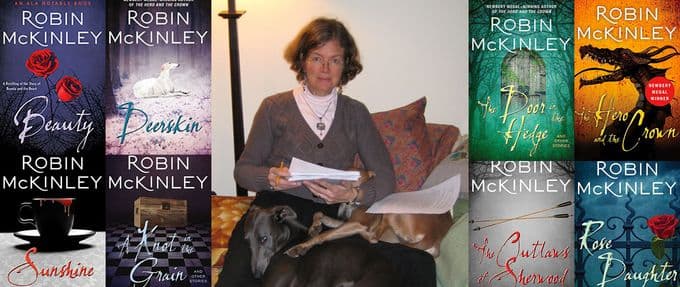 robin mckinley surrounded by her book covers